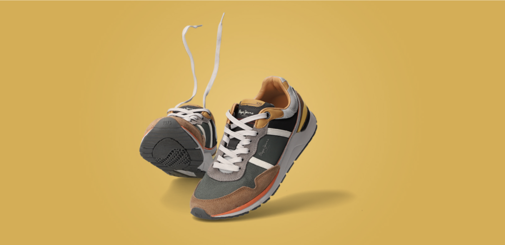 sneakers on coloured background